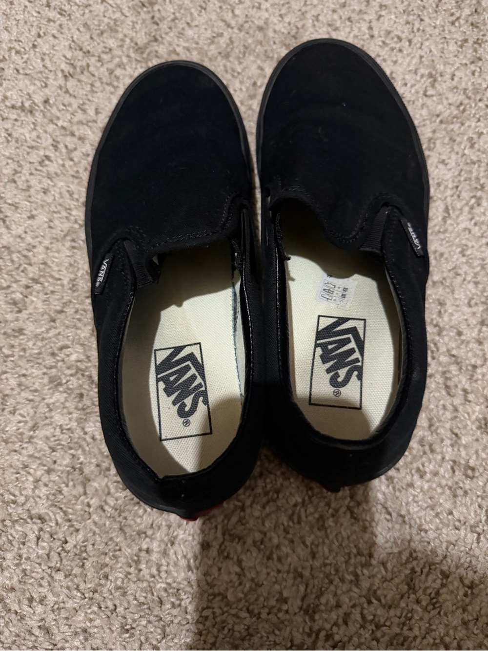 Vans women’s Classic Slip-On Shoes in Black